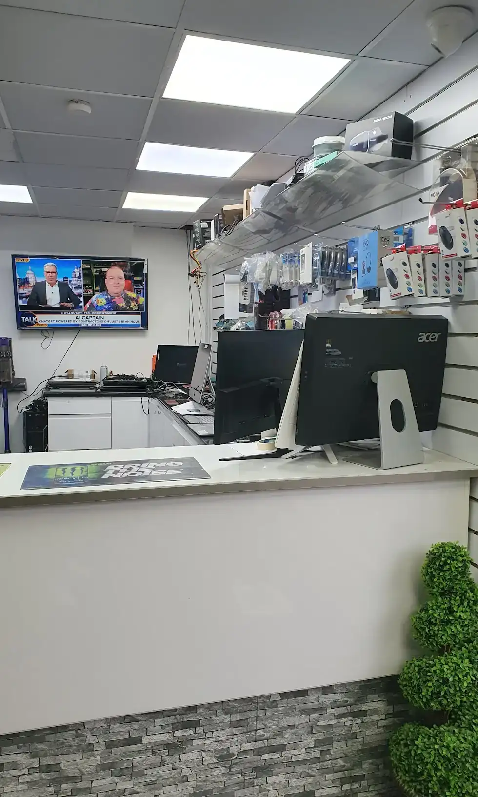 Our repair counter with monitors and accessories ready for diagnostics